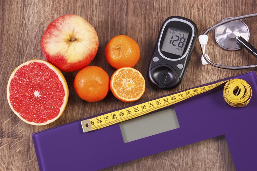 Glucometer, vegetables and measuring tape.