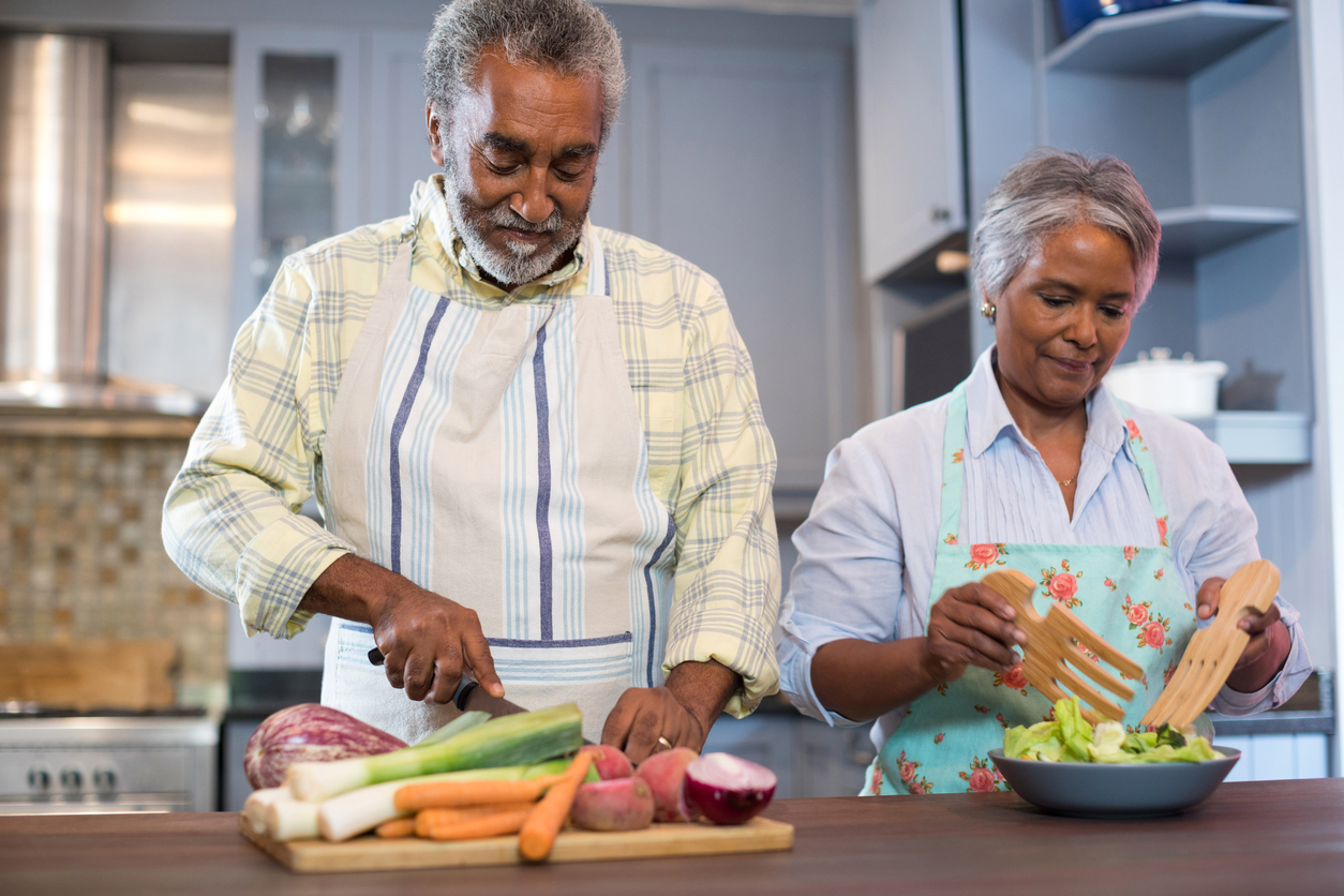 Adults preparing a vegetarian meal