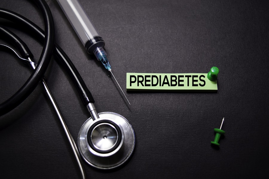 Stethascope and needle with insulin illustrating prediabetes